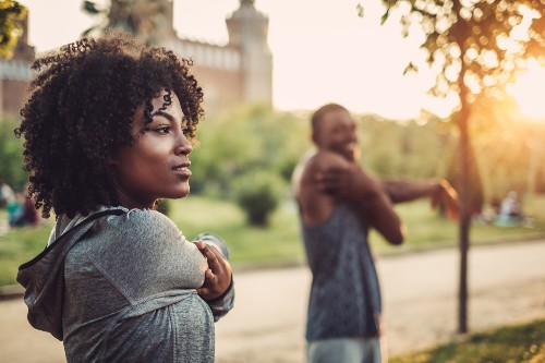 man and women stretching