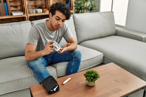 man sitting on couch