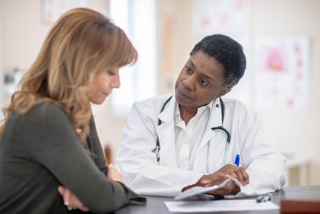 doctor discussing whole-person care with patient