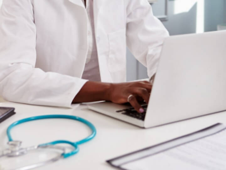 doctor working on laptop