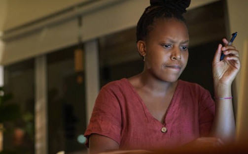 confused woman at desk