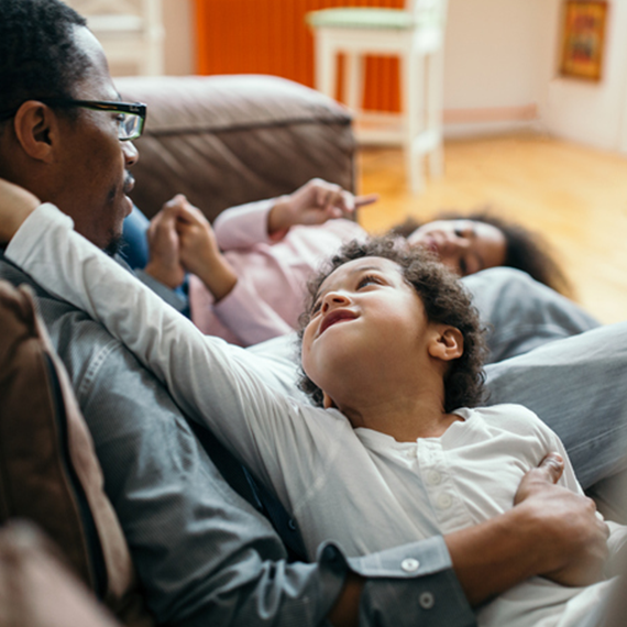 Dad and kids on couch