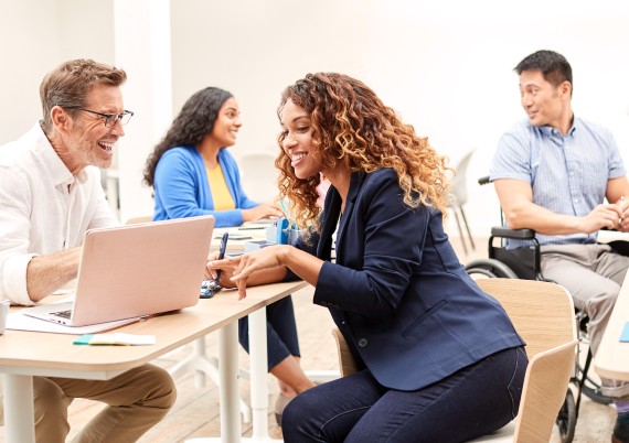 Diverse group of employees working together in office