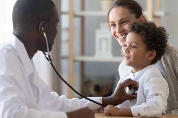 doctor with mom and child