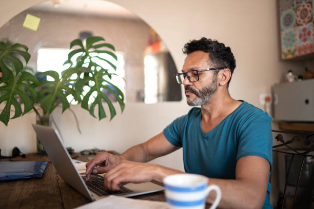 hispanic man at computer