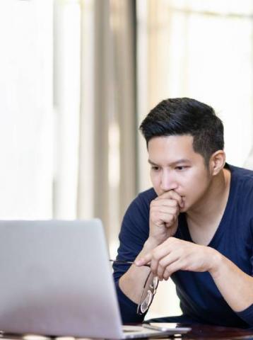 man looking at laptop