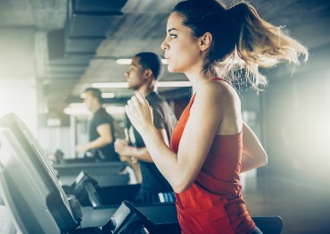 Woman on treadmill at gym