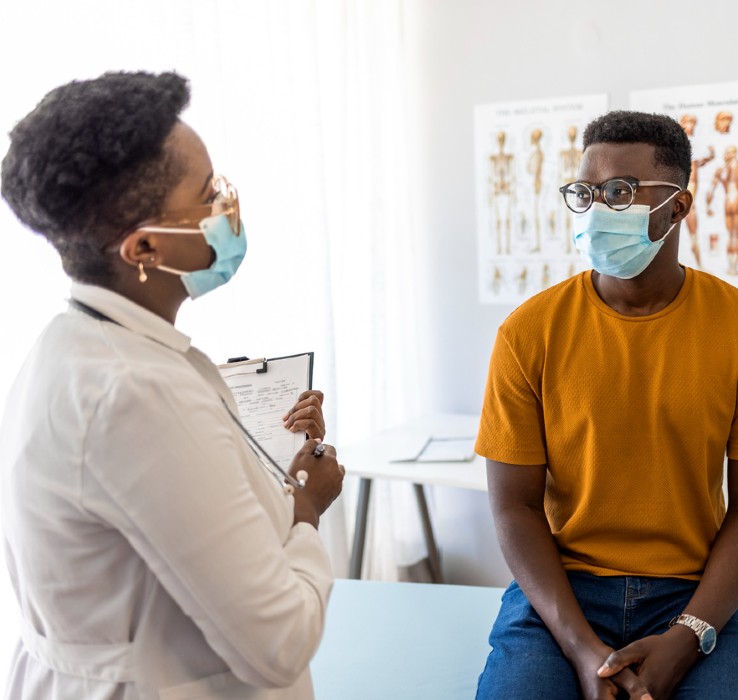 Diagnostic Clinic Medical Group doctor talking with male patient
