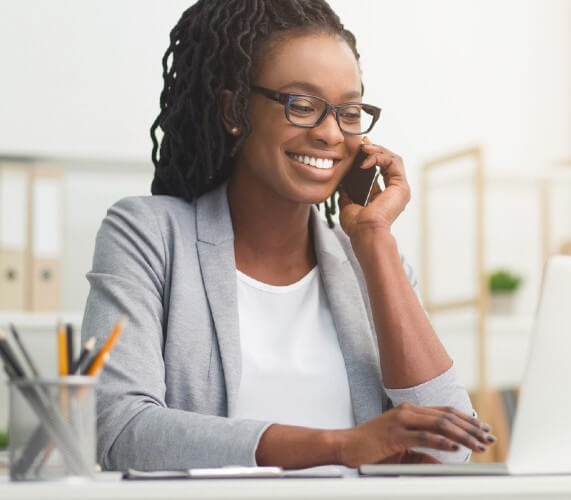 Woman agent at desk on phone