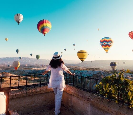 Woman watching hot air balloons