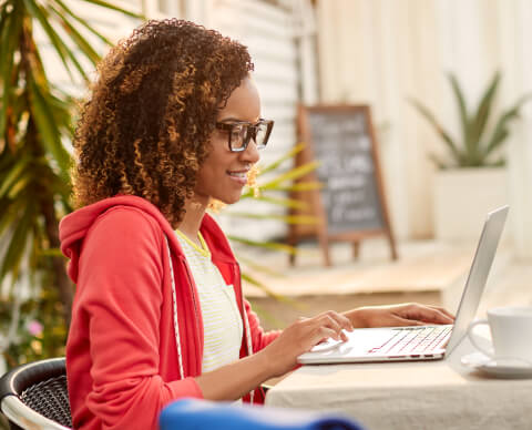 young person learning about health insurance on laptop